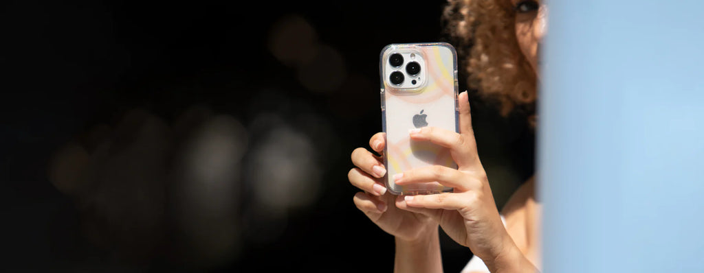 action shot of an iphone with the incipio design series case being used to take a photo
