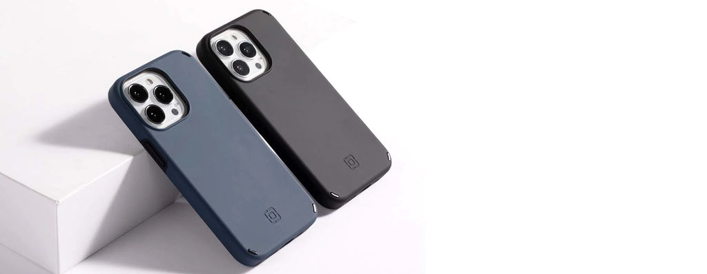Black and Blue Duo cases leaning against an edge camera side facing up