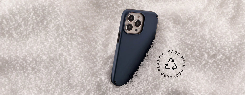 Duo phone case sticking out of recycled plastic pellets