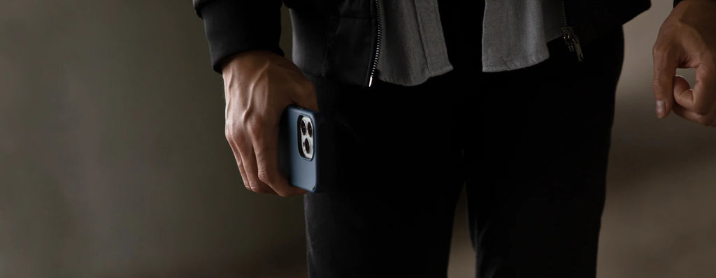 zoomed in picture of a man holding an iphone with a duo case